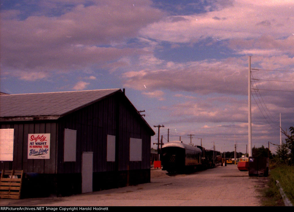 Work train behind the engine house in NS yard